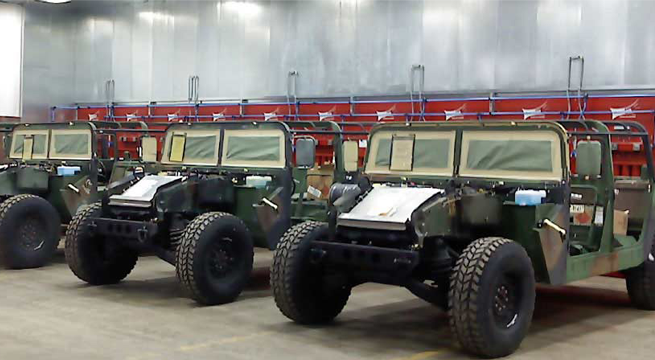 Twelve module CAB system captures sanding and grinding dust at military vehicle refurbish facility.