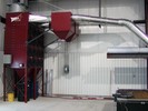 RP8-2, 16 cartridge dust collector, equipped with dual in-line 4000CFM spark arrestors, and ducted to hood over laser cutting table, effectively removes cutting smoke and fume