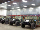60 foot Clean Air Booth, configured with twelve power modules captures fiberglass sanding dust in military refurbishment center. 